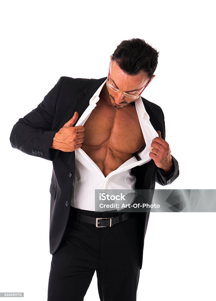 Businessman opening his shirt revealing muscular torso Businessman opening his shirt revealing muscular torso, on white background 2015 Stock Photo