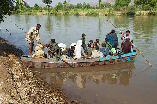 River Nil, Egypt - December 8, 2024. Men from the Boat Selling Goods to the Tourist on Nile River Cruise