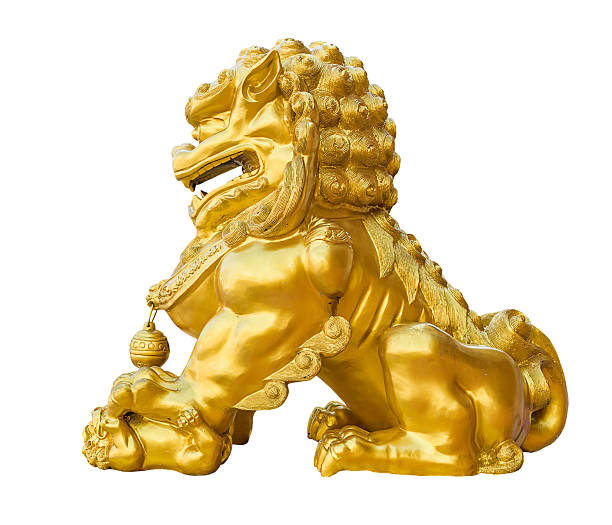 istock gold lion statue on white background. 533333022