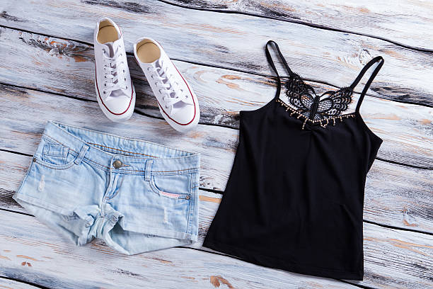 istock Denim shorts with dark top. 533333802