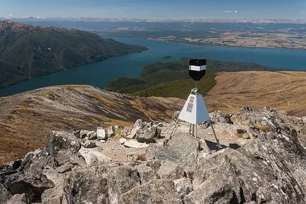 trig point above lake Te Anau in Fiordland in New Zealand