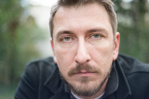 istock Handsome man looking to camera in park 533334388