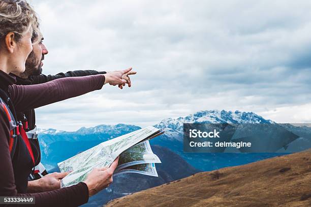 Hiking Couple With Map In Mountain Stock Photo - Download Image Now - Guidance, Map, Direction