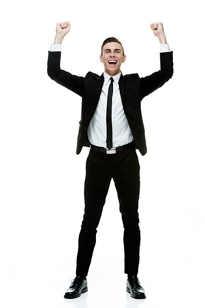 istock Cheerful businessman cheering with hands raised 533335369