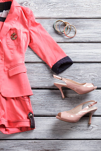 istock Salmon short suit and heels. 533337586