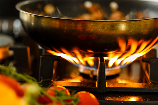 Frying pan on gas stove, close-up