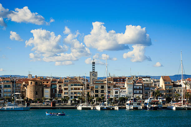 Cambrils waterfront, Spain. CAMBRILS, SPAIN - APRIL 09, 2016: View of Cambrils Port and city waterfront with Church Of Saint Peter in middle and Torre del Port. cambrils stock pictures, royalty-free photos & images