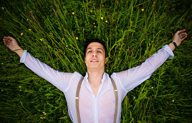istock Man laying on the ground in nature 533343592