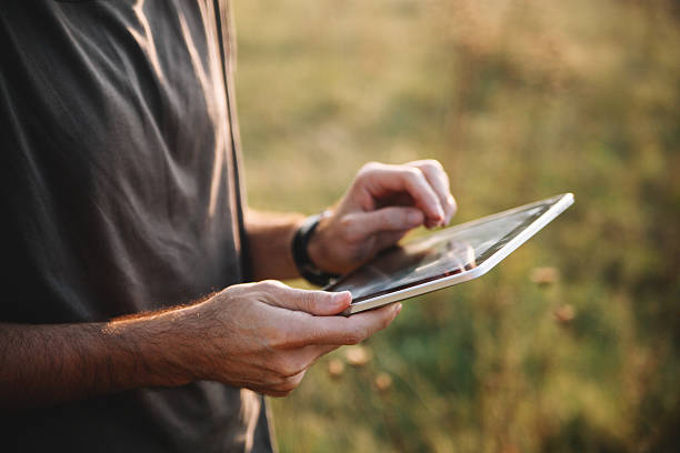 istock Closeup of male hands using a digital tablet 533343855