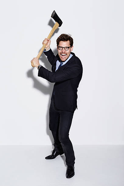 istock Businessman threatening with axe, portrait 533343910