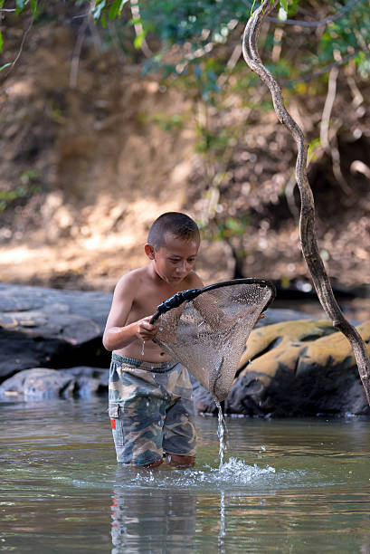 istock Boy fishing. 533344222