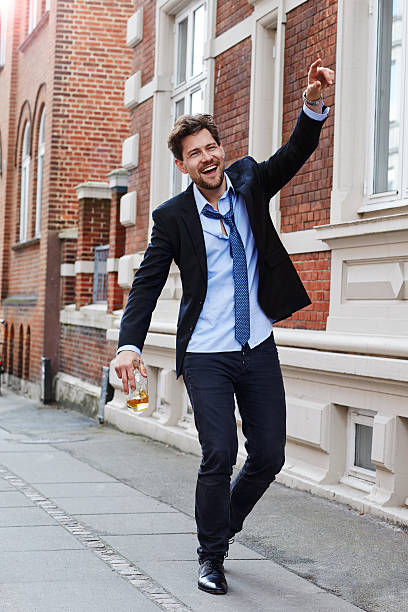 istock Happy drunken dude in business suit 533344560