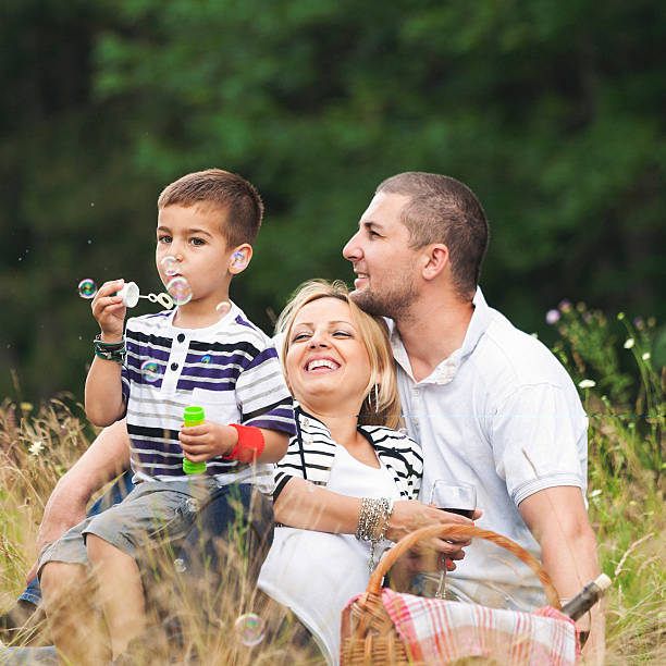 istock Happy family having nice time outdoors 533344927