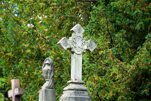 Old crosses on graves and tombstones of cemetery in Brussels Laeken.