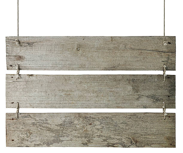 istock Three sign boards, weathered wood hanging by old rope. 533345472