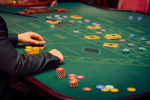 istock people playing roulette at the casino 533346079