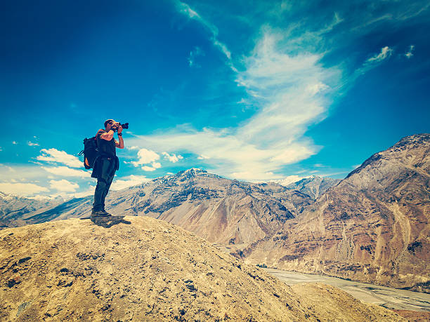 istock Photographer taking photos in Himalayas 533346092