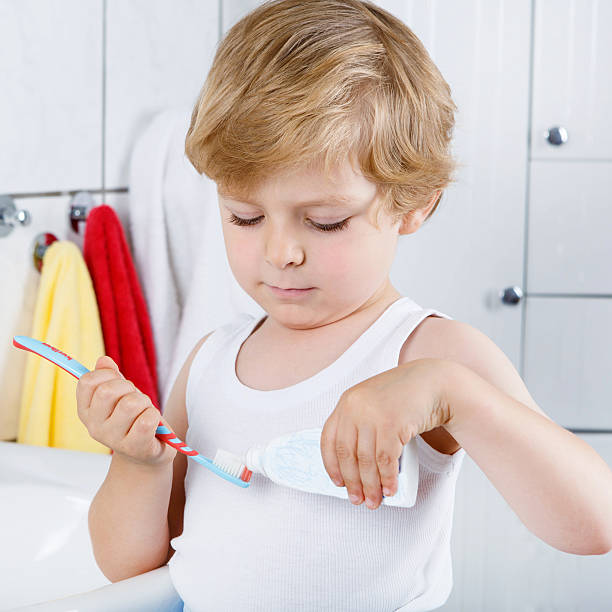 istock Lovely toddler boy brushing his teeth, indoors 533346174