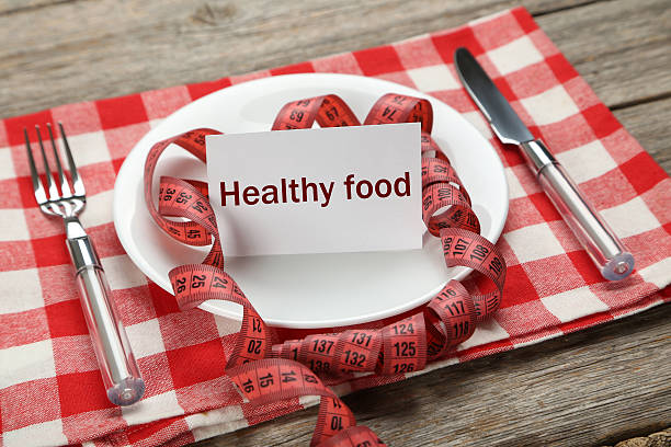 istock White plate on a grey wooden table 533346344