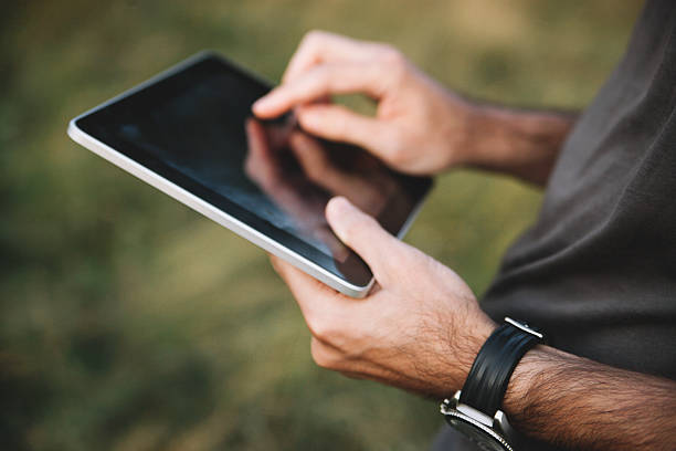 istock Vintage toned image of outdoor tablet use 533346655