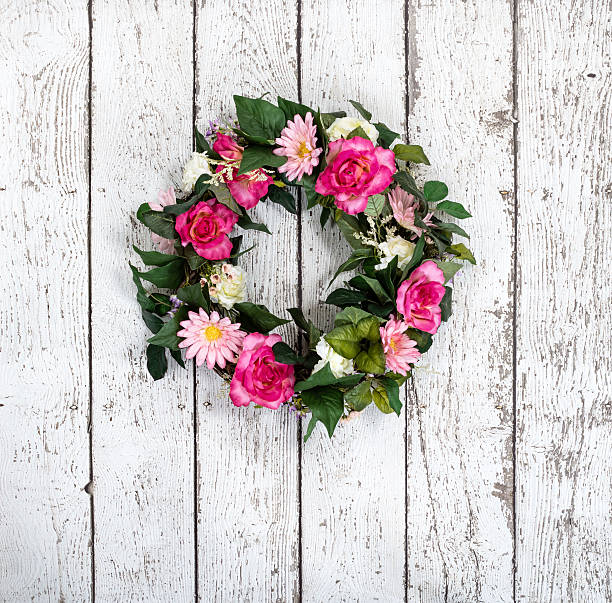 istock Flower wreath on vintage white background 533347525
