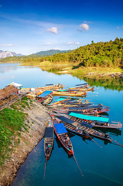 istock long tail boat in a dock at  ratchaprapha dam 533348203