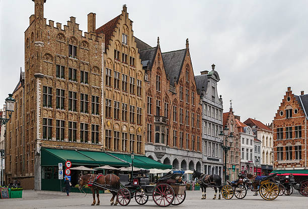 Markt (Market Square) of Bruges is located in the heart of the city, Belgium. Carriages for sightseeing