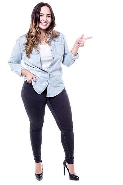 istock Caucasian woman pointing to her left 533350936
