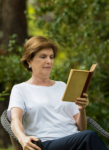 istock Senior Woman Reading a Book 533353022