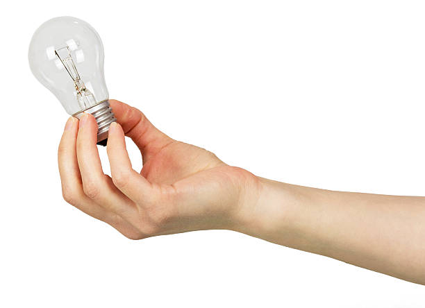 istock The female hand lamp bulb isolated on white 533353086