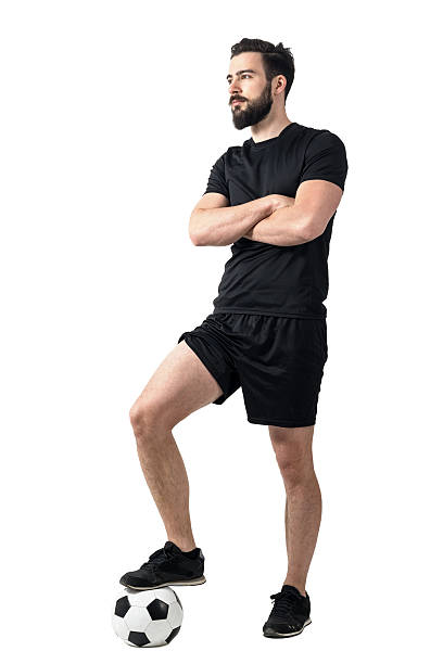istock Confident soccer player with crossed arms looking away 533354034