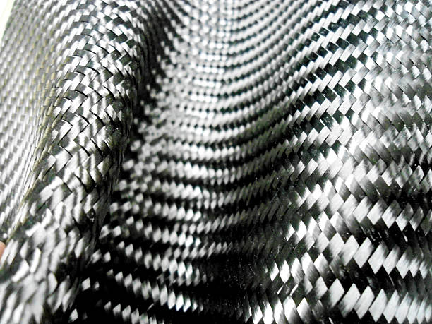 istock Carbon fiber composite raw material background 533356312