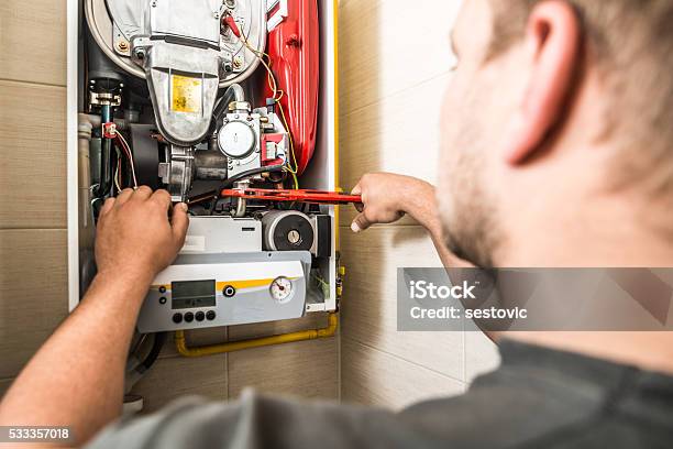 Furnace Maintenance Stock Photo - Download Image Now - Repairing, Furnace, Boiler