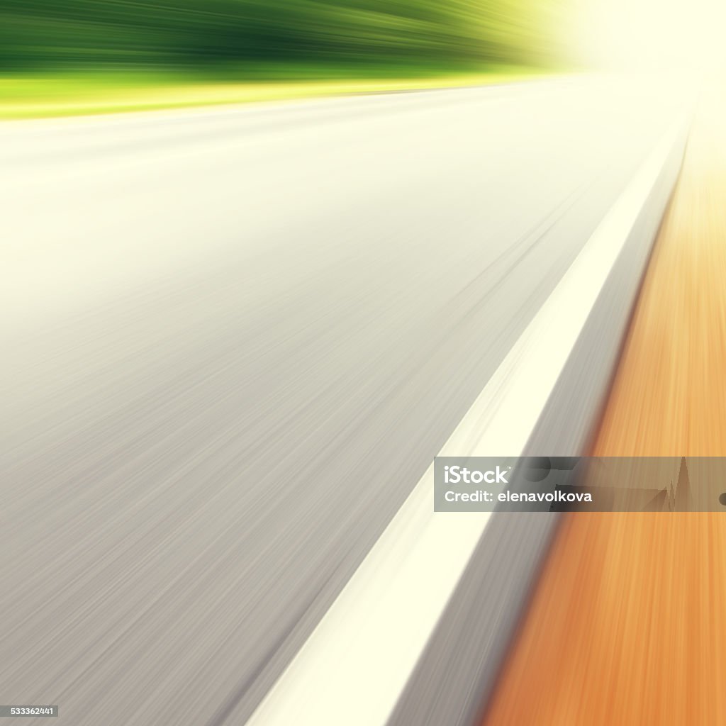 Country road in motion blur and sunlight. Country asphalt road in motion blur and sunlight. 2015 Stock Photo