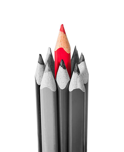 istock Red pencil surrounded by black and white pencils 533363357