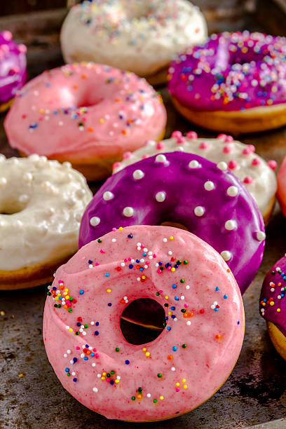 istock Fresh Baked Vanilla Bean Iced Doughnuts 533363987