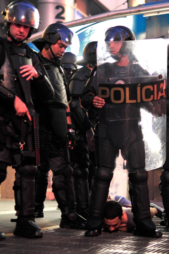 São Paulo, Brazil, January, 09, 2015: Protester arrested by police in riot act for the reduction of transport tariffs in Consolação Avenue