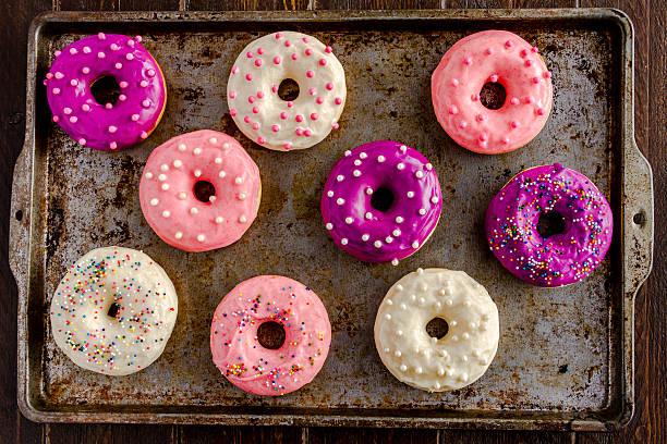 istock Fresh Baked Vanilla Bean Iced Doughnuts 533364399