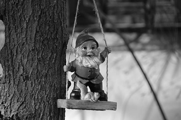 istock Garden gnome on a swing 533365333