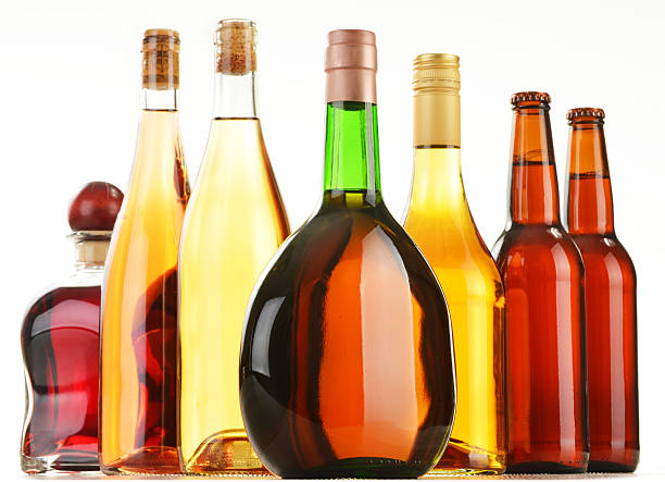 istock Bottles of assorted alcoholic beverages isolated on white 533366025