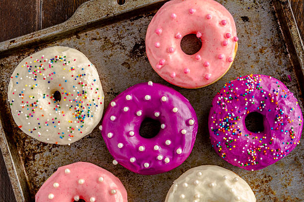 istock Fresh Baked Vanilla Bean Iced Doughnuts 533366531
