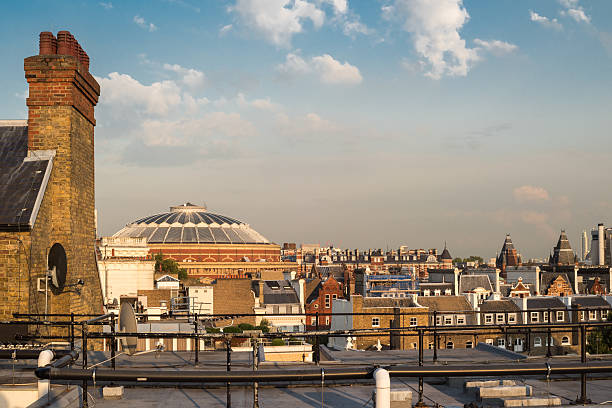 view of roofs in London view of roofs in London with top of Royal Albert Hall in South Kensington royal albert hall stock pictures, royalty-free photos & images