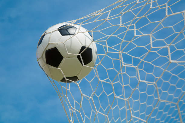istock Soccer ball in the goal after shooted 533367739