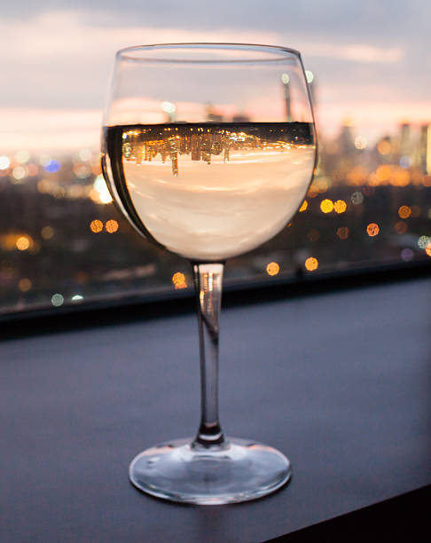 istock Glass of wine with city view 533368675