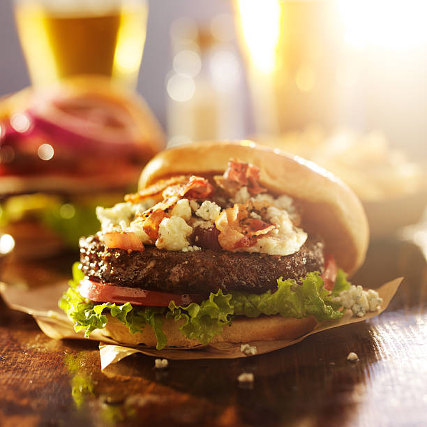 istock bacon and bleu cheese gourmet hamburger with beer 533368929