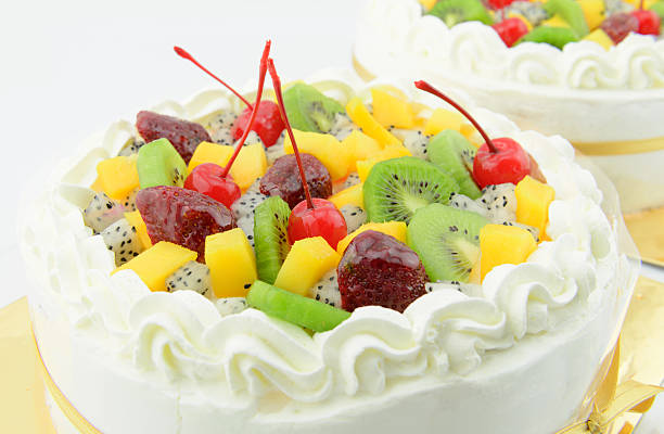 istock fruits cake fresh cream on white background 533374503