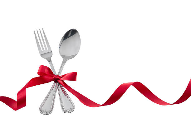 istock Utensils Fork Spoon with Red Ribbon isolated on white 533374853