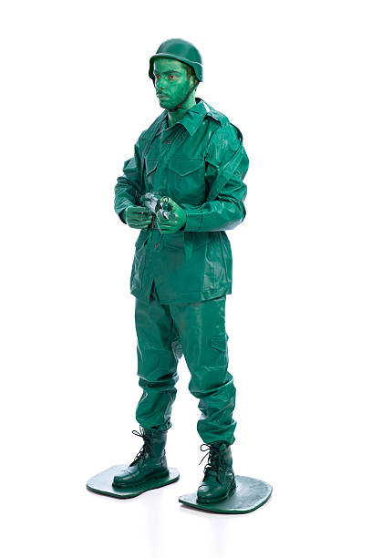 istock Man on a green toy soldier costume 533375113