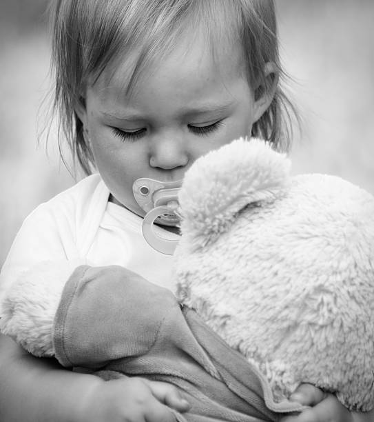 istock Cute baby eyes hugging a mascot. 533375699