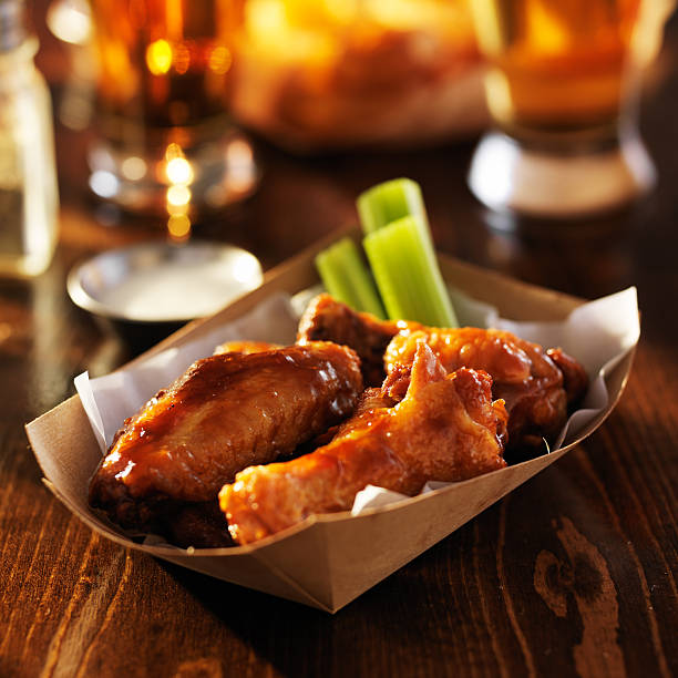 istock barbecue chicken wings in disposable tray 533375975